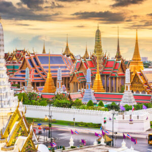 Bangkok, Thailand at the Temple of the Emerald Buddha and Grand Palace at dusk.